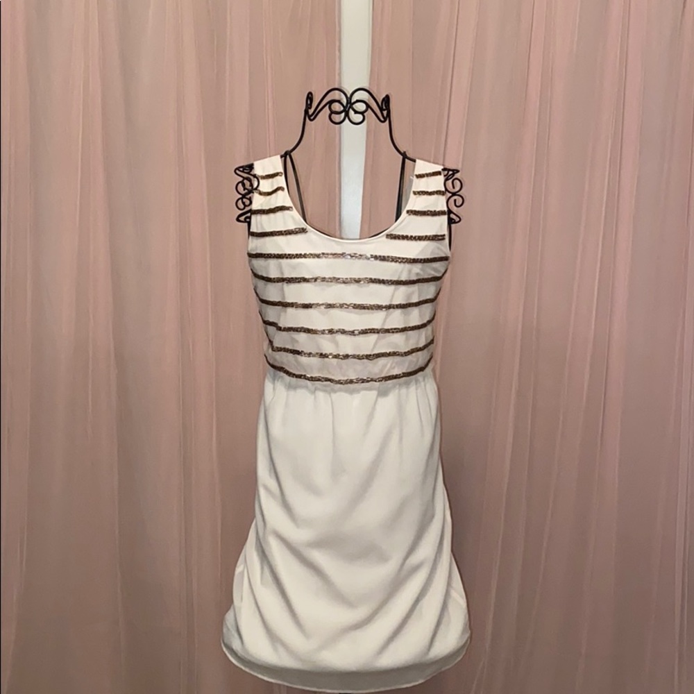 Francesca’s cream and studded gold dress